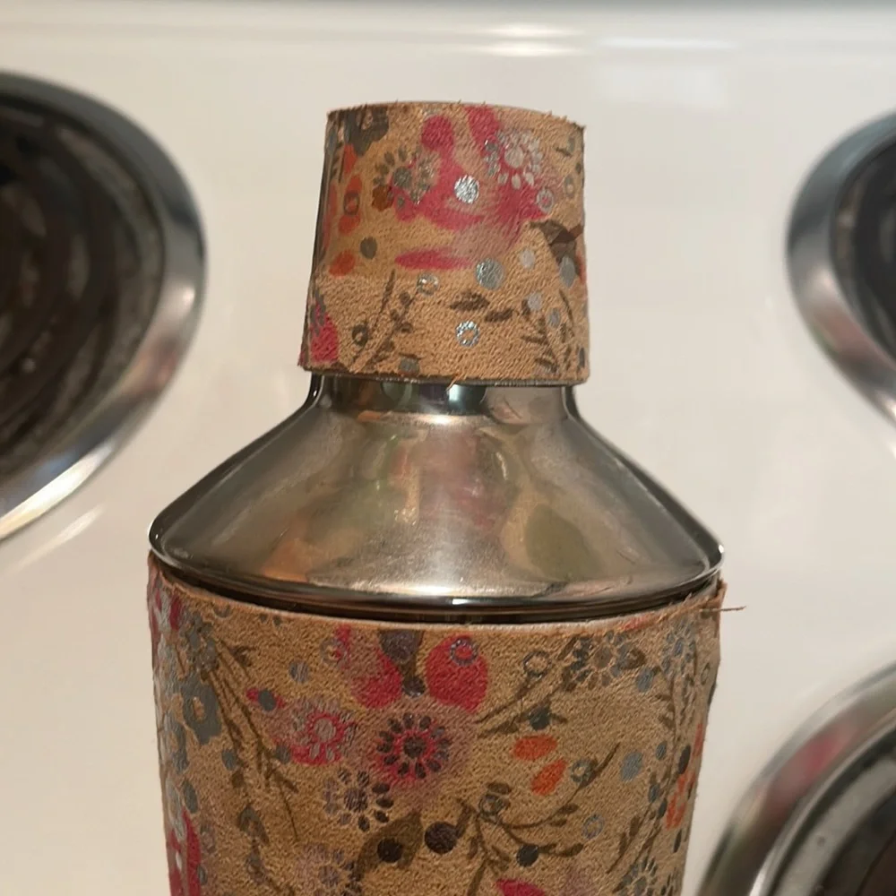 Martini shaker, only used once. Shaker has detailed, beautiful floral design.